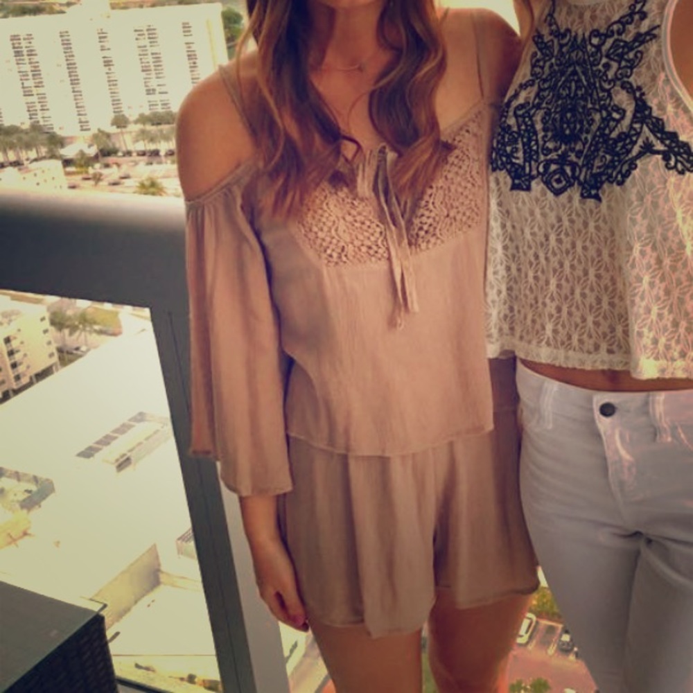 Tan open shoulder romper with crisscross back